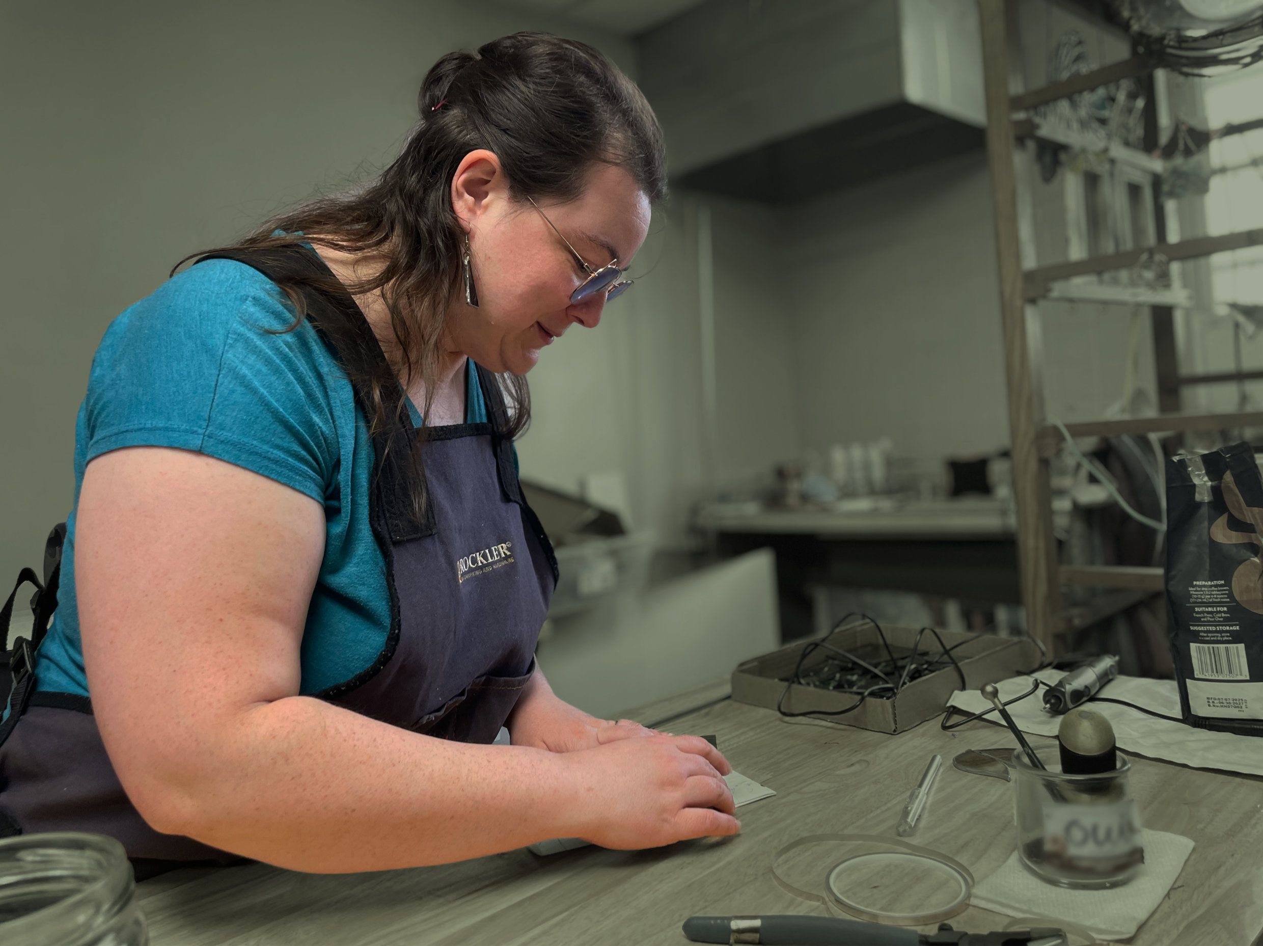 Holly Harris crafting glass in her workshop